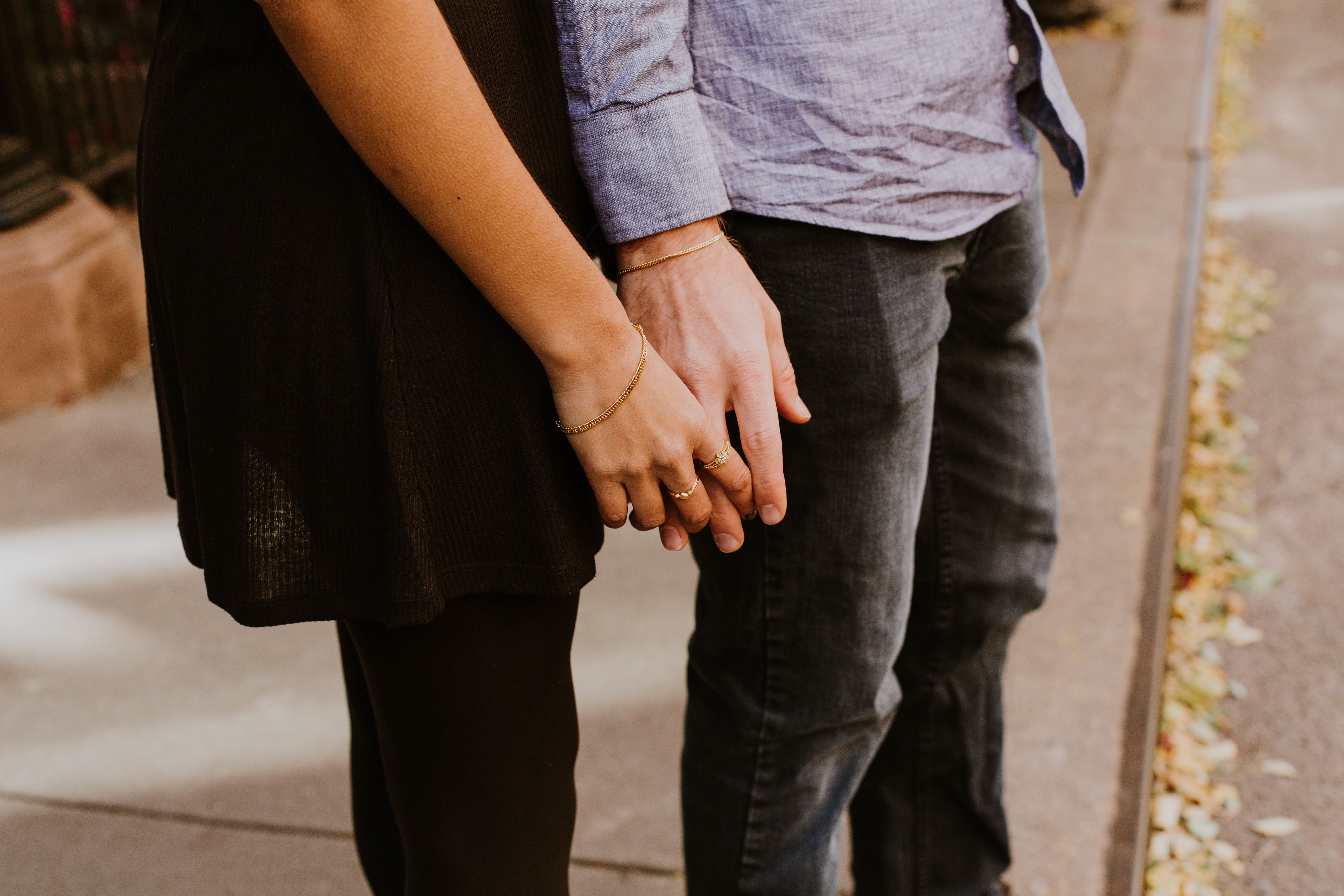 Couple holding hands in the street